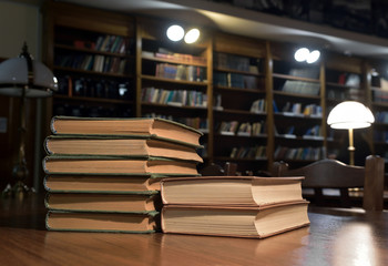 piles of books on table