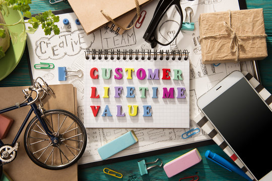 Customer Lifetime Value - Inscription  On The Desk