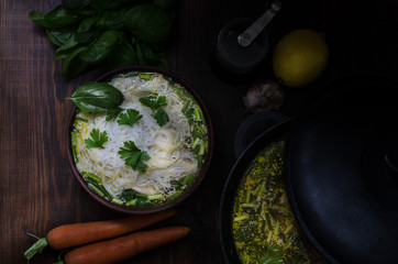 Thai chicken noodle soup, dark moody still life