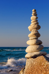 Fototapeta na wymiar Concept of harmony and balance. Rock Zen at sunset