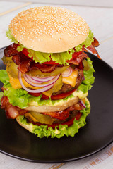 Burger With Beef, Bacon, Tomato, Cheese, Lettuce and Onion