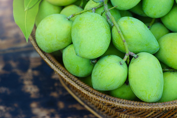 Fresh green mango in basket