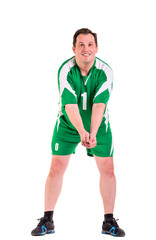 Mature man dressed in green sportswear posing