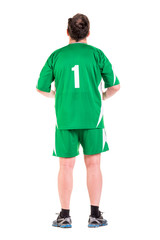 Mature man dressed in green sportswear posing