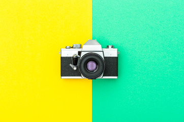 Vintage camera on color hipster background Instagram style