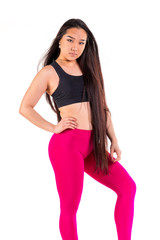 Young asian woman in sportswear posing