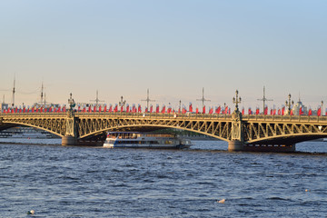 Boat floats Neva river at Trinity bridge