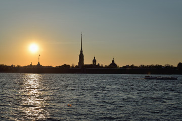 Fototapeta na wymiar Sunset over Peter and Paul fortress on the Neva river