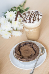 Delicious chocolate brownie cake with ice coffee.