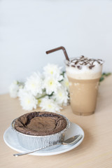 Delicious chocolate brownie cake with ice coffee.