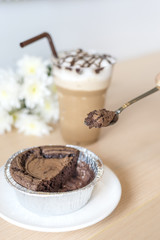 Delicious chocolate brownie cake with ice coffee.