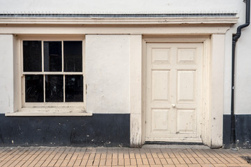 Fototapeta na wymiar White Painted Wooden Door and Black Window