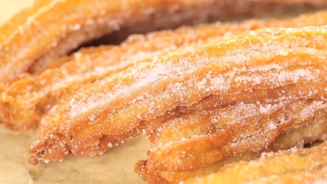 Bunch of churros covered with granulated sugar