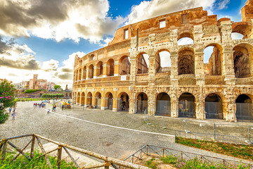 Side view of the Colosseo, Colosseum, Flavian Amphitheatre, the largest amphitheater in the world and one of the symbols of Italy. Symbol of Rome, located in historical center, Unesco Heritage Site.