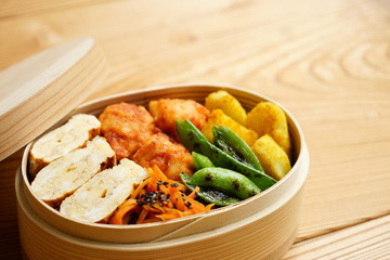 Home cooked healthy Bento lunch box with fresh vegetables and organic meals