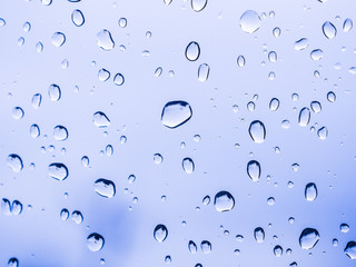 Close up water drops on blue background