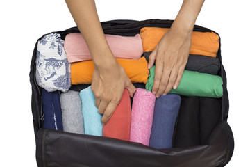 Obraz premium woman packing a luggage for a new journey on white background