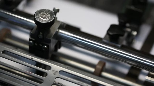 Details and mechanisms of the printing machine in motion