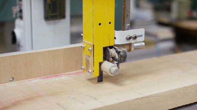  Close up of timber being cut with a band saw