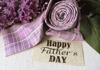 Beautiful purple lilac and tie for father's day. Greeting card. Abstract concept background for father's day celebration