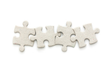 top view of puzzle jigsaw on white background