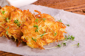 Potato pancakes with green sprouts