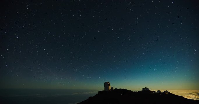 Star time lapse, milky way galaxy moving across the night sky above observatory