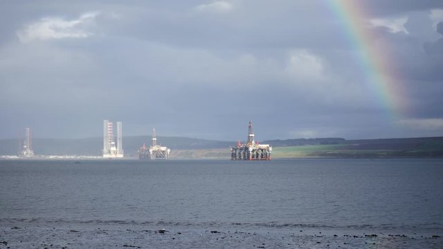 Semi Submersible Oil Rigs and Rainbow at Cromarty Firth in Invergordon, Scotland
