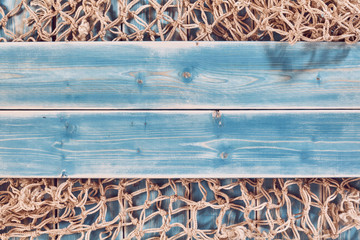 Fishing Net and Blue Painted Wood Planks