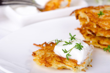 Potato pancakes with sour cream sauce