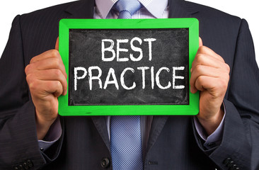 businessman hold a blackboard with words best practice