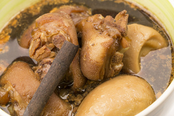 Close-up eggs and pork in brown sauce