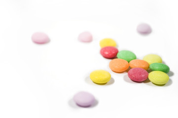 Colorful candy macro focus and blur back ground on white paper. 