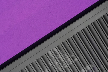 Diagonal offset shot of urban detail. Wall and shop shutter.