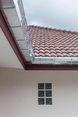 gutter roof on house in rainy day
