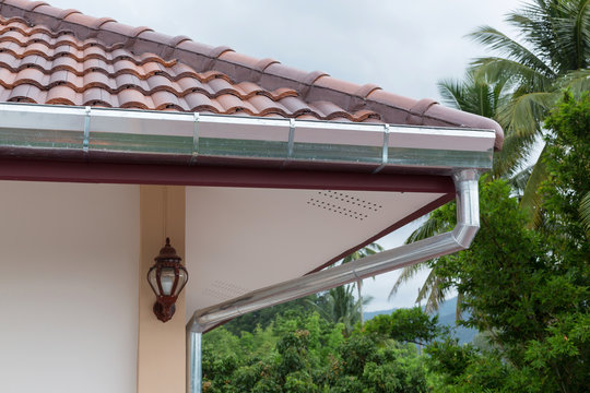 Gutter Roof On House In Rainy Day