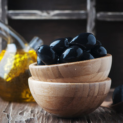 Black olive on the wooden table