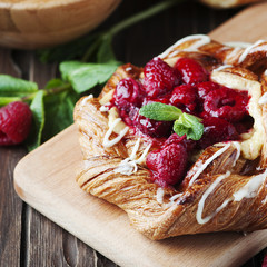 Sweet homemade cake with fresh berry and mint