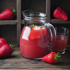 Sweet fresh strawberry juice on the vintage table