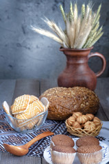 Different cookies and bread, on older boards