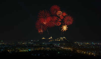 Big colorful fireworks over the palace on the mountain top in Thailand