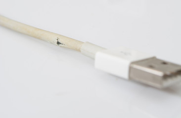 Closeup the Broken Charger Cable on white background