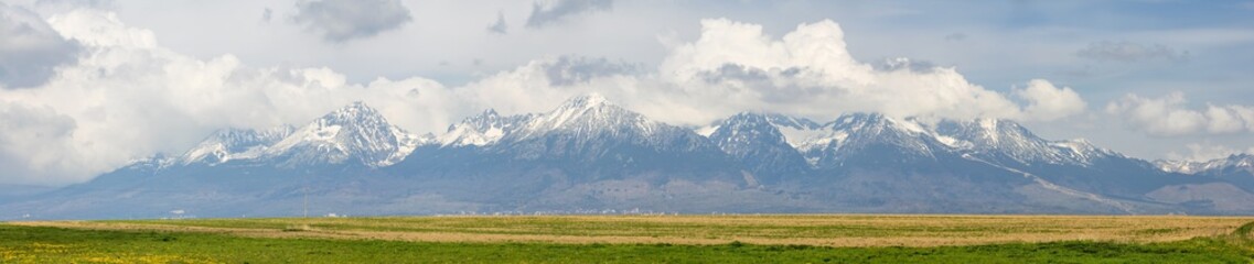 Fototapeta premium panoramic view of high mountains in clouds in Slovakia