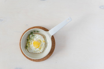 Fried eggs at white background
