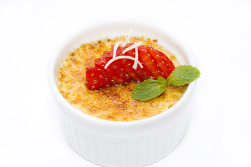 portion of the cream brulee on a white background