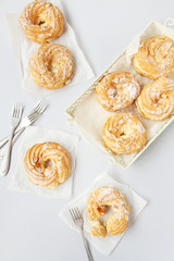 Sweet and tasty eclairs on a white background