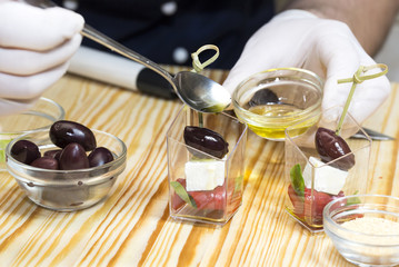 cook prepares canapes in the kitchen at the restaurant