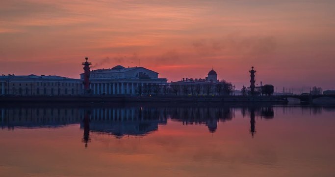 Russia, Saint-Petersburg, 28 March 2016: Timelapse of water area of Neva River at sunset, water mirror, reflections, Birzhevoy, Dvorcovy, Palace bridge, Stock Exchange Building, Rastralnye columns