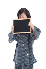 Cute asian boy holding black board on white background