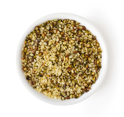 Bowl of hemp seeds isolated on white, from above